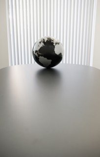 Globe on conference room table.
