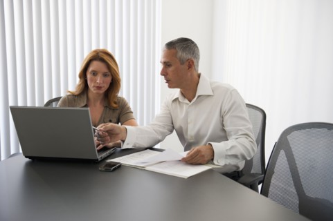 Business people in conference room.