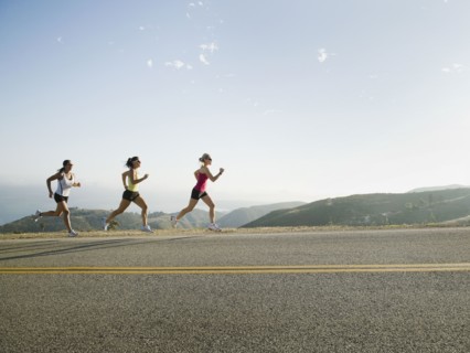 Runners training on side of a road. Photo. Erik Isakson