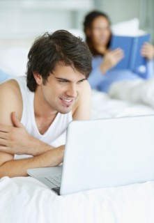 Man browsing the internet. Photo. momentimages