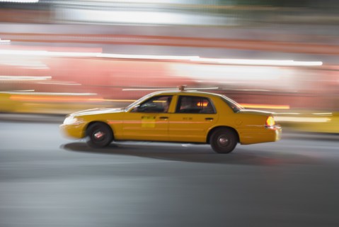 Taxi cab driving at night. Photo : Antonio M. Rosario