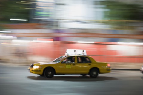 Taxi cab driving at night. Photo : Antonio M. Rosario