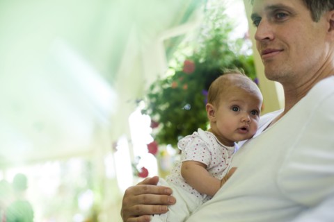 Father and baby daughter sitting on porch. Photo : Tim Pannell
