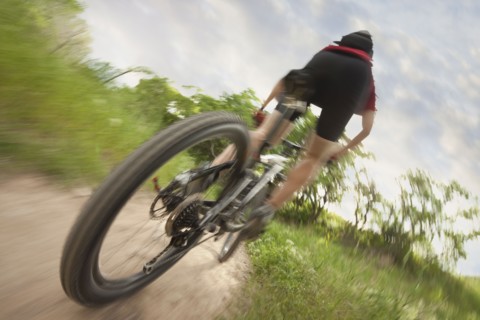 Cyclist on single track trail. Photo. Mike Kemp