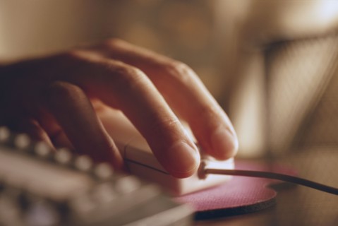 Hand on a computer mouse. Photo. Stewart Cohen