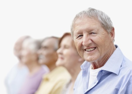 Group of seniors standing in a row. Photo. momentimages