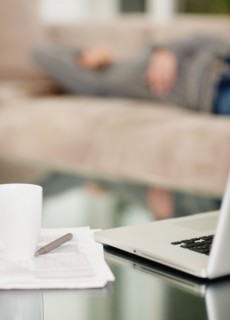 Paperwork and laptop on desk. Photo. momentimages