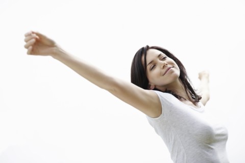 Carefree woman stretching. Photo. momentimages