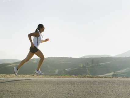 Runner training on the side of the road.