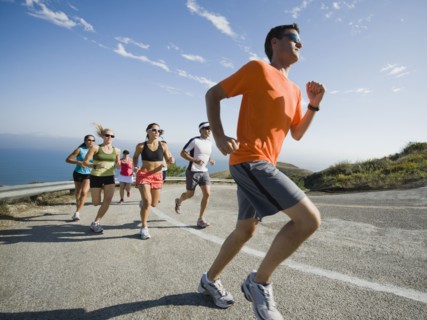 Runners on a road in Malibu.