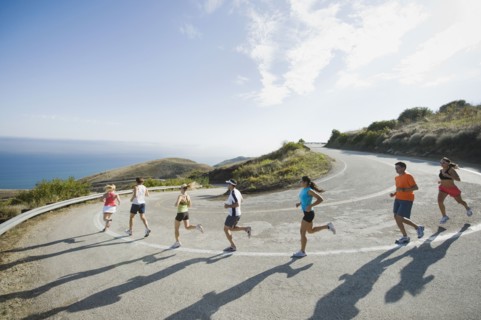 Runners on a road in Malibu.
