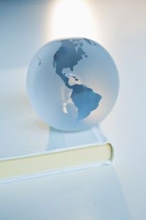 Globe on a book.
