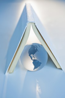 Globe under a book.