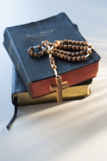 Rosary on bible.