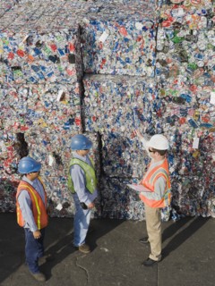 Workers at recycling plant.