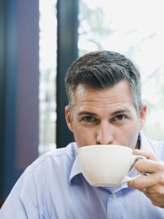 Man drinking coffee.