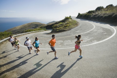 Runners on a road in Malibu.