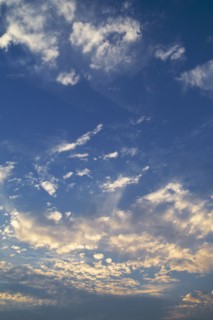 Clouds in blue sky at dusk.