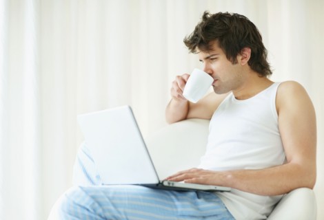 Relaxed man browsing the internet. Photo. momentimages