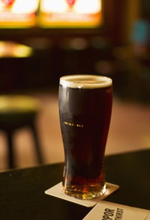 Glass of Irish ale in pub.