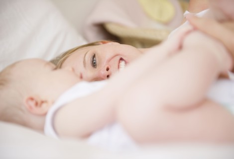 Mother and baby lying down together. Photo : Jamie Grill