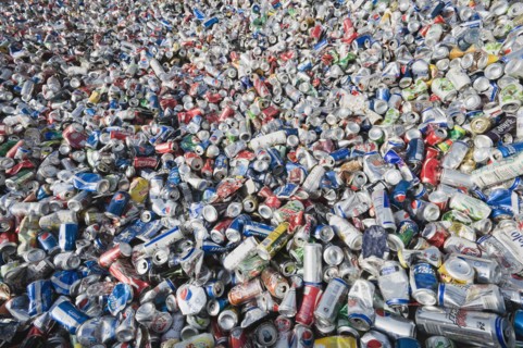 Pile of aluminum cans at recycling plant.
