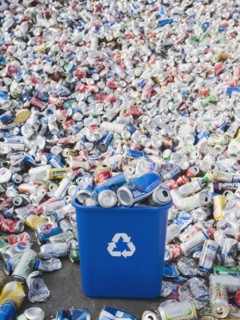 Pile of aluminum cans at recycling plant.