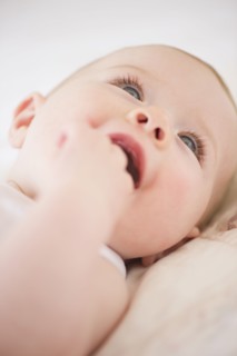 Baby lying down. Photo : Jamie Grill