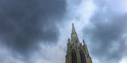 Dark clouds over steeple on Grace Church.