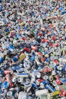Pile of aluminum cans at recycling plant.