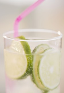 Lime slices in glass of water. Photo. Jamie Grill