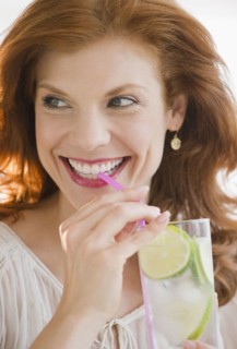 Woman drinking lime water. Photo. Jamie Grill