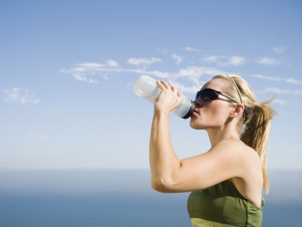 Runner having a drink of water.