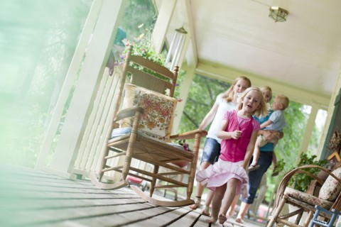 Family on porch. Photo : Tim Pannell