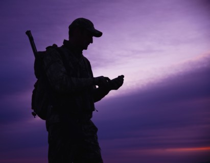Big game hunter at dusk. Photo. Mike Kemp