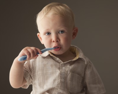 Toddler brushing his teeth. Photo. Mike Kemp