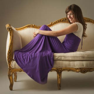 Elegant woman sitting on antique sofa. Photo. Mike Kemp