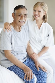 Nurse sitting with patient. Photo. momentimages