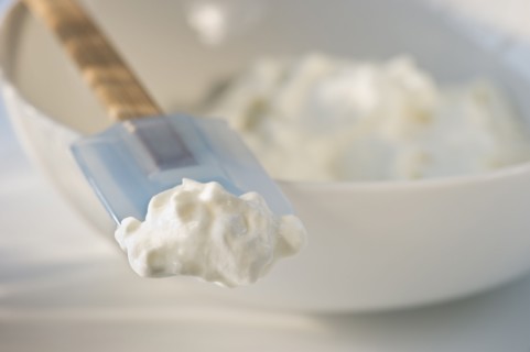 Whipped cream on rubber spatula. Photo. Daniel Grill