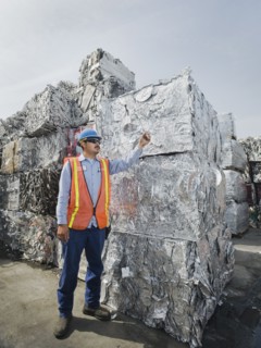 Worker at recycling plant.