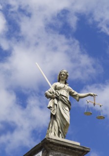 Scales of justice statue on the Dublin castle.