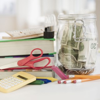 Stationery and jar of money. Photo : Jamie Grill