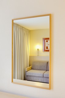 Sofa reflection in mirror of luxury home. Photo : Jon Boyes