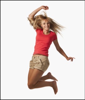 Young woman jumping on white background. Photo : Mike Kemp