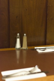 Salt and pepper condiments on cafe table. Photo : Antonio M. Rosario