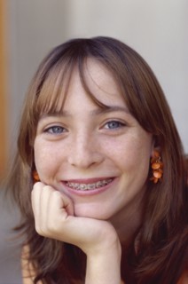 Young girl with braces. Photo : Fisher Litwin