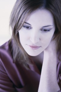 Pensive woman. Photo : Fisher Litwin