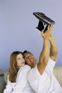 Playful couple taking self portrait. Photo : Fisher Litwin