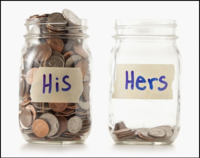 Studio shot of two jars with coins labeled "Hers" and "His". Photo : Mike Kemp