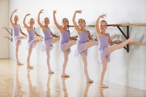 Row of female ballet dancers (6-8) in dance studio. Photo : Mike Kemp